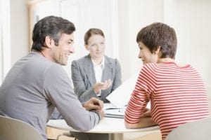 Couple meeting with real estate agent.