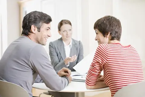 Couple meeting with real estate agent.