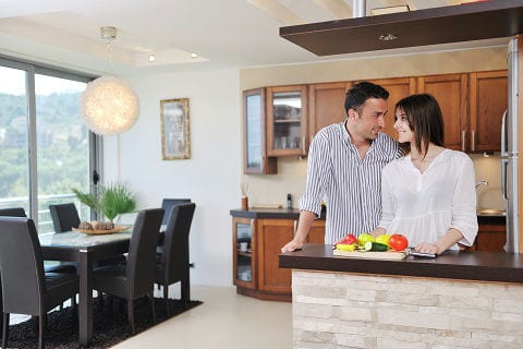 Couple in a kitchen.