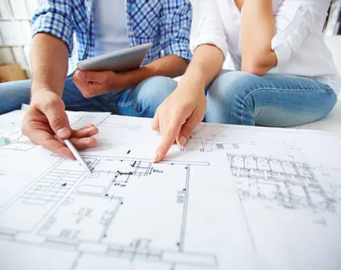 Hands of young couple during discussion of plan. 