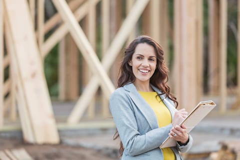 Young woman at a building site. 