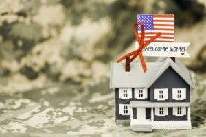 Graphic of a house with American flag and welcome home sign.