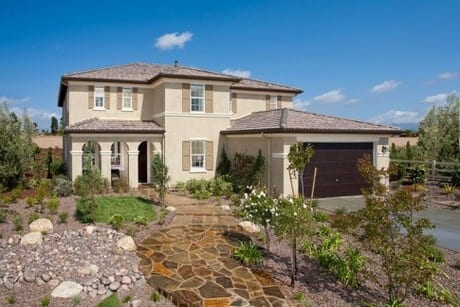 Exterior of home with zero landscaping.
