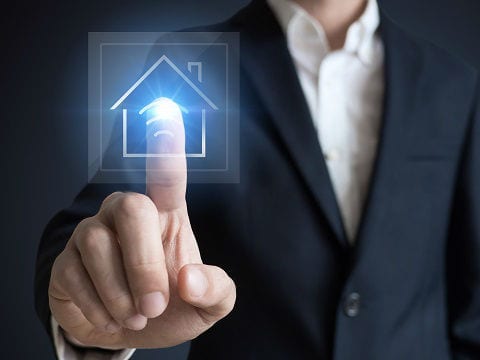 Man touching a smart keypad