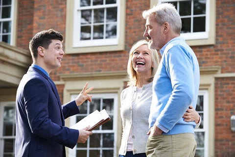 Older couple chatting with Realtor